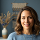 Close-up portrait of a smiling woman in her mid-30s with a healthy, happy expression.
